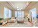 Bright living room featuring a sectional sofa, plush rug, and large windows with classic shutters for ample natural light at 340 President St, Charleston, SC 29403