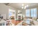 Cozy living room with hardwood floors, fireplace, modern lighting, and an adjacent dining room, perfect for entertaining at 340 President St, Charleston, SC 29403