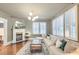 Inviting living room with a fireplace, hardwood floors, and a comfortable sectional couch at 340 President St, Charleston, SC 29403