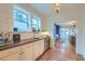 Elegant wet bar with custom cabinets, wood counters, and an undercounter refrigerator at 340 President St, Charleston, SC 29403