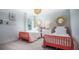 Inviting bedroom showcasing two red twin beds, patterned wallpaper, and decorative mirrors at 341 Pine Crest View Dr Dr, Summerville, SC 29486