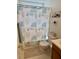 Bathroom with shower/tub and blue and white floral patterned curtain at 3415 Pawtucket St, Charleston, SC 29414