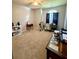 Spacious bedroom with beige carpet and a large window at 3415 Pawtucket St, Charleston, SC 29414