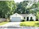 Charming single-story home with a manicured lawn and attached two-car garage at 3415 Pawtucket St, Charleston, SC 29414