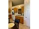 Kitchen featuring tiled floors, a sink under the window and lots of wooden cabinets at 3415 Pawtucket St, Charleston, SC 29414