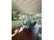 Relaxing screened porch with outdoor seating and a view of the lush backyard at 3415 Pawtucket St, Charleston, SC 29414
