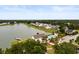 Aerial view featuring a pool and clubhouse by a lake surrounded by homes at 3431 Great Egret Dr, Johns Island, SC 29455