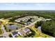 Aerial view of the neighborhood featuring a serene pond and lush green surroundings at 3431 Great Egret Dr, Johns Island, SC 29455