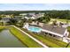 Aerial view of a neighborhood pool, surrounded by houses and a lush landscape at 3431 Great Egret Dr, Johns Island, SC 29455