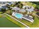 Aerial view of a neighborhood pool and amenity center near lush landscaping and parking at 3431 Great Egret Dr, Johns Island, SC 29455