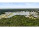 Aerial view showcases a residential community nestled along a winding river at 3431 Great Egret Dr, Johns Island, SC 29455