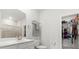 Bright bathroom with white vanity, quartz countertops, and walk-in closet at 3431 Great Egret Dr, Johns Island, SC 29455