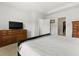 Bright bedroom with a large bed, dresser and natural light coming in through a window at 3431 Great Egret Dr, Johns Island, SC 29455