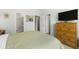 Bedroom with a chest of drawers, a TV, and convenient access to the bathroom and walk-in closet at 3431 Great Egret Dr, Johns Island, SC 29455