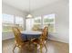 Sunlit breakfast nook with natural light, wood floors, and serene view to backyard at 3431 Great Egret Dr, Johns Island, SC 29455