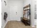 Modern entryway with coat rack, wood flooring, and view to secondary bedrooms at 3431 Great Egret Dr, Johns Island, SC 29455