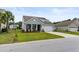 Charming home with gray siding, a one-car garage, and a well-manicured lawn at 3431 Great Egret Dr, Johns Island, SC 29455