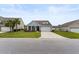 Beautiful gray home with a well-kept lawn, showcasing the two-car garage and welcoming facade at 3431 Great Egret Dr, Johns Island, SC 29455