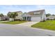 Inviting gray home with well-manicured lawn, two-car garage, and a traditional design at 3431 Great Egret Dr, Johns Island, SC 29455