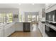 Bright kitchen featuring white cabinetry, modern appliances, and eat in breakfast area at 3431 Great Egret Dr, Johns Island, SC 29455