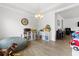 Bright playroom with hardwood floors, chandelier, and plenty of space for activities at 3431 Great Egret Dr, Johns Island, SC 29455