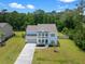 Aerial view of a beautiful two-story home with a double porch and manicured lawn at 4007 Oxeye, Johns Island, SC 29455