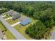 A picturesque aerial view captures a blue home, showcasing the generous lot size and community charm at 4007 Oxeye, Johns Island, SC 29455