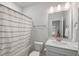 Bathroom featuring a bathtub, toilet, white vanity, and mirror at 4007 Oxeye, Johns Island, SC 29455
