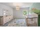 Charming Bedroom with pink accents, delightful wall art, and whimsical chandelier at 4007 Oxeye, Johns Island, SC 29455