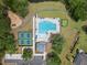 An aerial view of the community pool, putting green, playground, and tennis courts showcases various recreational amenities at 4007 Oxeye, Johns Island, SC 29455