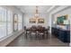 Elegant dining room featuring hardwood floors, chandelier, and well-appointed furnishings at 4007 Oxeye, Johns Island, SC 29455