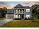 Beautiful two-story home with inviting front porch, visible at dusk at 4007 Oxeye, Johns Island, SC 29455