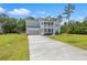 Two-story home featuring a double porch, well-maintained lawn, and long driveway at 4007 Oxeye, Johns Island, SC 29455