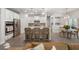 Beautiful open-concept kitchen with white cabinets, center island, and stylish bar seating at 4007 Oxeye, Johns Island, SC 29455