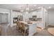 Modern kitchen with stainless steel appliances, white cabinets, an island with bar stool seating, and pendant lights at 4007 Oxeye, Johns Island, SC 29455