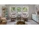 A reading nook with two chairs in front of a window that looks onto a fenced-in back yard at 4007 Oxeye, Johns Island, SC 29455