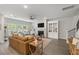 Cozy living room with a fireplace, large windows, and comfortable seating at 4007 Oxeye, Johns Island, SC 29455
