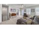 Bright living room with a ceiling fan, gray sofa, and stairs to a bedroom at 4007 Oxeye, Johns Island, SC 29455