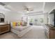 Spacious main bedroom featuring a tray ceiling, ceiling fan, and large windows at 4007 Oxeye, Johns Island, SC 29455