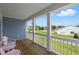 Inviting front porch featuring wooden floors and calming views of the neighborhood at 4007 Oxeye, Johns Island, SC 29455