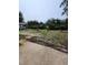 Large backyard with concrete patio, shed, and garden area at 4029 Karen Dr, North Charleston, SC 29405