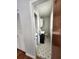 Bathroom with a dark vanity and sink, toilet, shelves and storage behind the door at 4029 Karen Dr, North Charleston, SC 29405