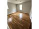 Bedroom with hardwood floors, neutral walls, natural light and a window at 4029 Karen Dr, North Charleston, SC 29405