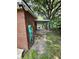 Side view of brick home showing access to covered parking carport at 4029 Karen Dr, North Charleston, SC 29405
