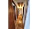 Hallway featuring hardwood floors, multiple doors and a ceiling access panel at 4029 Karen Dr, North Charleston, SC 29405