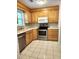 Kitchen featuring tile flooring, light wood cabinets, and modern stainless steel appliances at 4029 Karen Dr, North Charleston, SC 29405