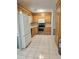 Spacious kitchen featuring tile flooring, light wood cabinets, and modern stainless steel appliances at 4029 Karen Dr, North Charleston, SC 29405