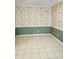 Bright living room featuring tile flooring, chair rail and elegant floral wallpaper at 4029 Karen Dr, North Charleston, SC 29405