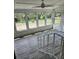 Sunroom with multiple windows offering backyard views and vinyl flooring at 4029 Karen Dr, North Charleston, SC 29405