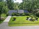 Aerial shot of home featuring beautiful landscaping, manicured lawn, and a welcoming driveway at 411 Dogwood Circle, Summerville, SC 29485